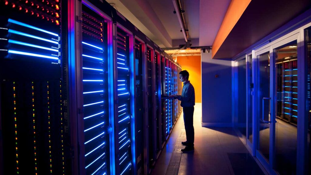man in data center in dark