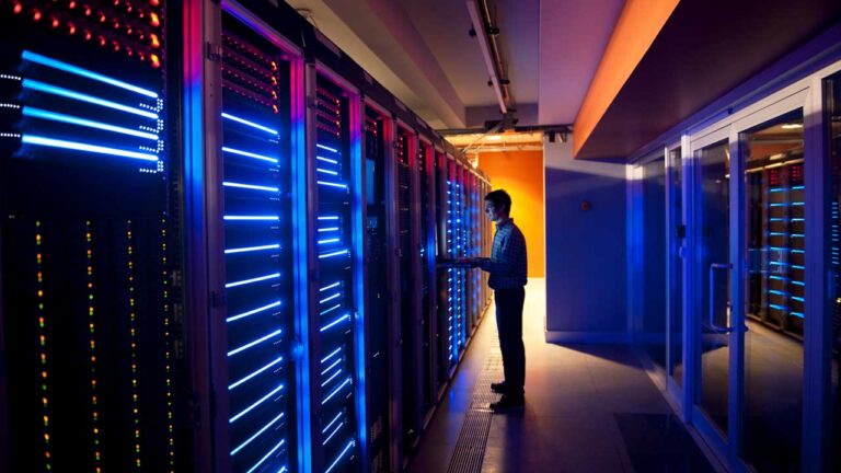 man in data center in dark