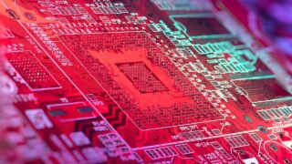 circuit board lit up with rainbow lights