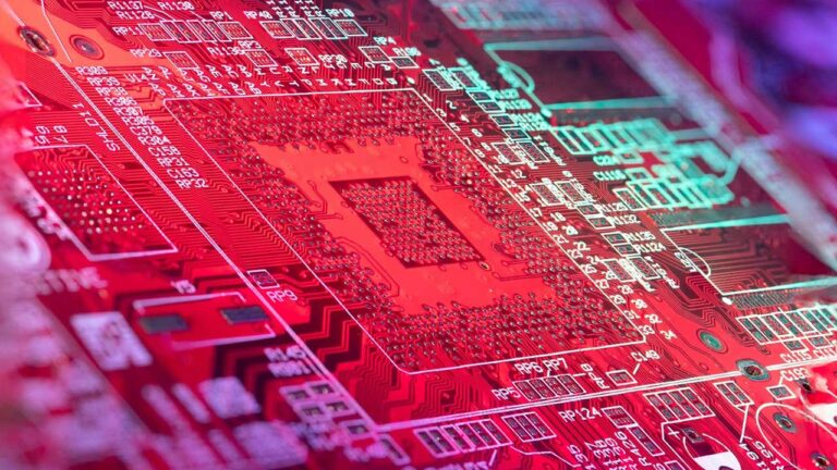 circuit board lit up with rainbow lights