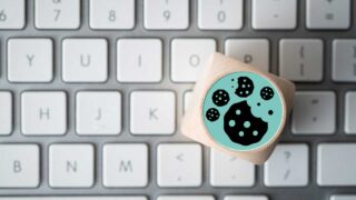 cube with cookie sticker on a keyboard