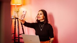 woman taking selfie with phone
