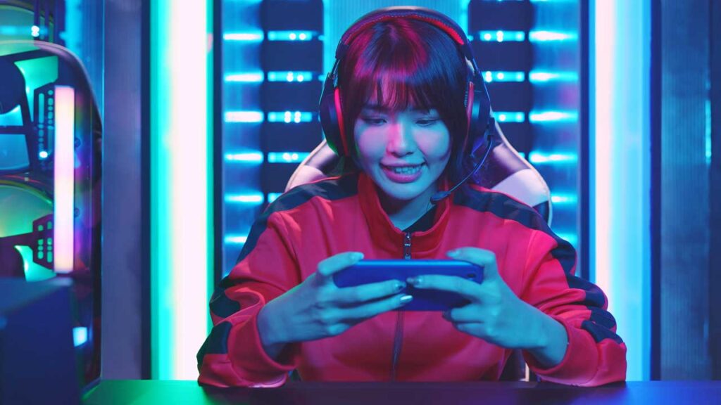 woman playing game on phone