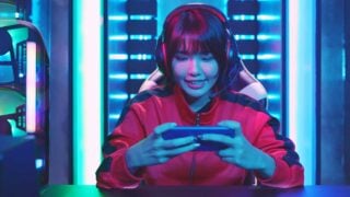 woman playing game on phone