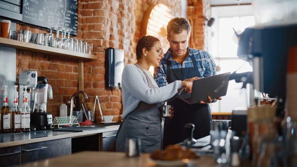 people working in cafe