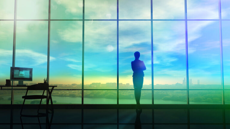 woman looking out huge windows