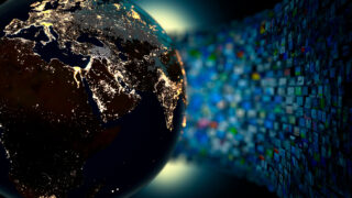 globe with hundreds of screens in the background