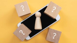 phone with cubes with question marks