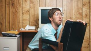 silly photo of man freaking out on office chair