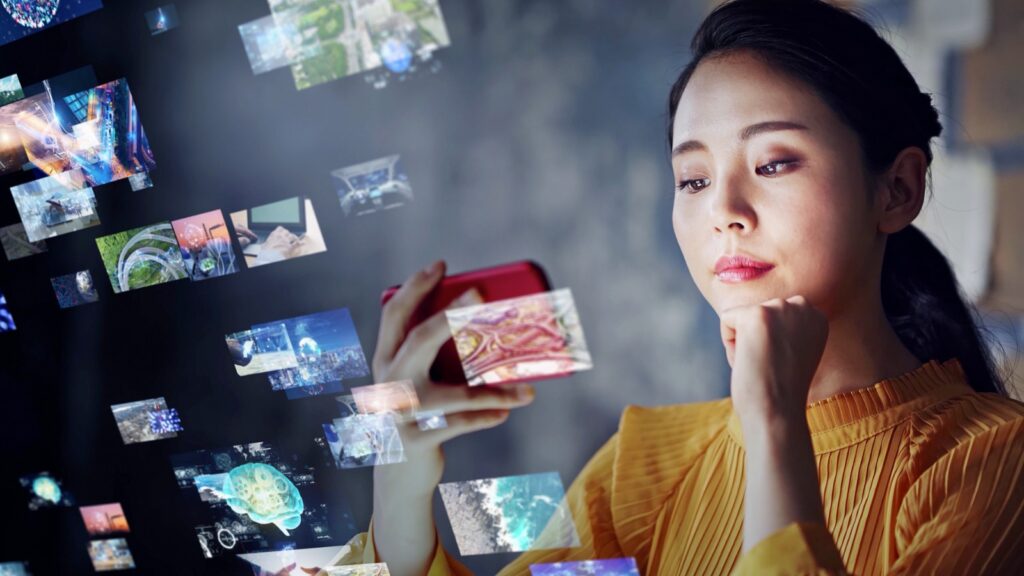 asian woman looking at phone