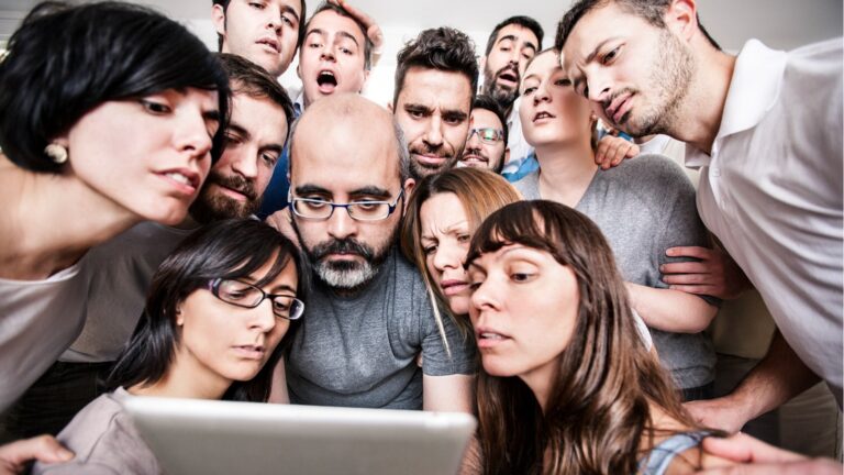 group of people looking at tablet