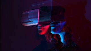 artistic rendering of people looking through VR glasses