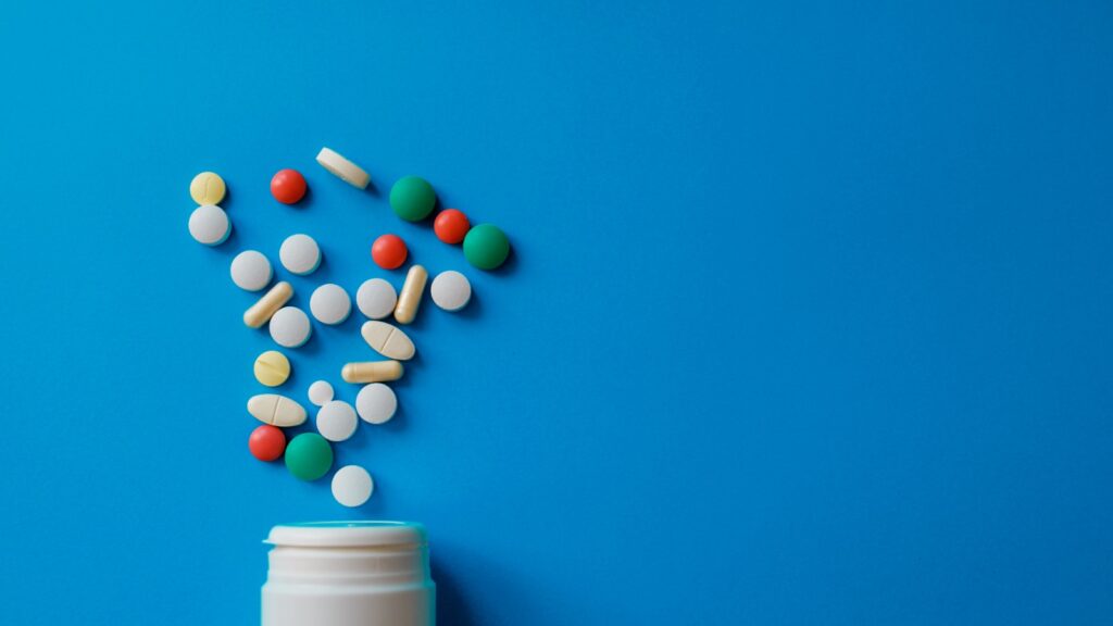 pills going into a bottle