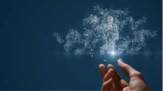 human hand holding image of person made of data points
