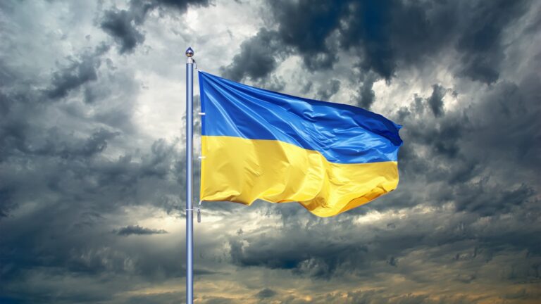 ukraine flag against stormy sky