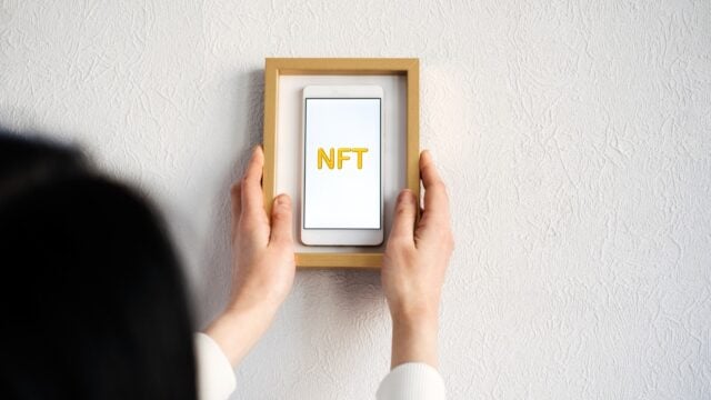 framed phone with NFT on screen