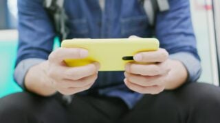 person playing game on phone