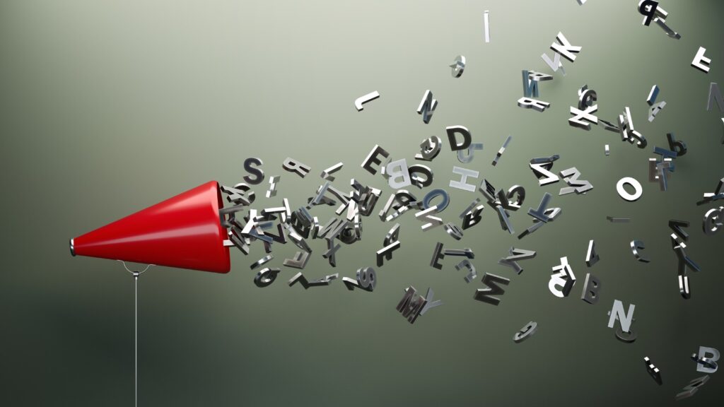 speaking cone with letters flying out of it