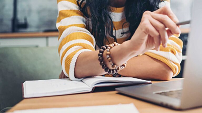 A female marketer using her MacBook