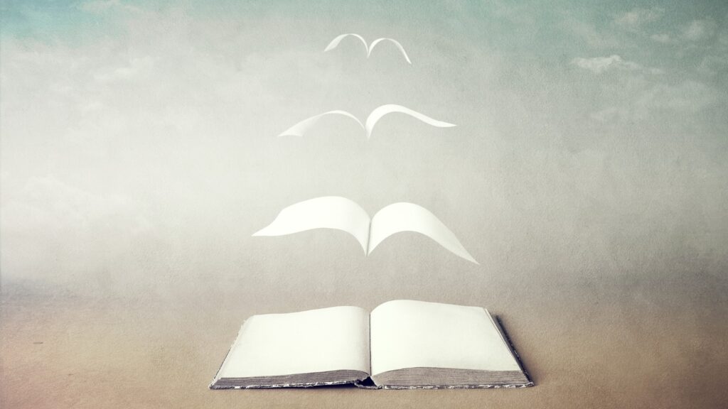 Surreal book concept pages flying out of book