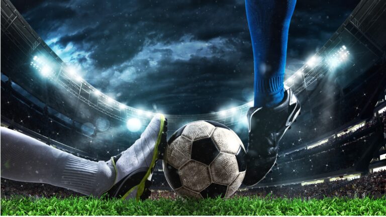 Close up of a football action scene with competing soccer players at the stadium