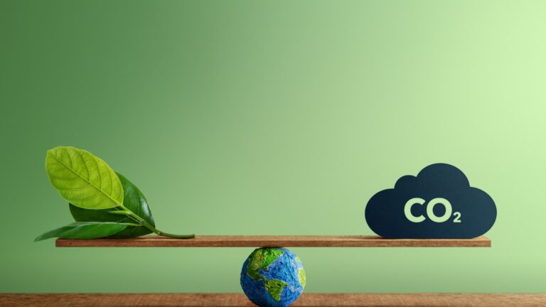 Carbon Neutral and ESG Concepts. Carbon Emission, Clean Energy. Globe Balancing between a Green leaf and CO2. Sustainable Resources, Big deal for Company and Indstry to Concern about Environmental stock photo