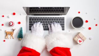Holiday online shopping theme with laptop stock photo