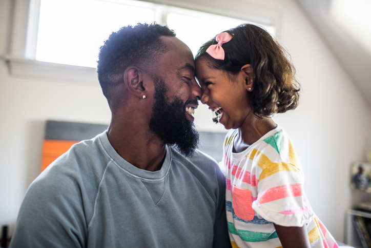 father and daughter laughing 