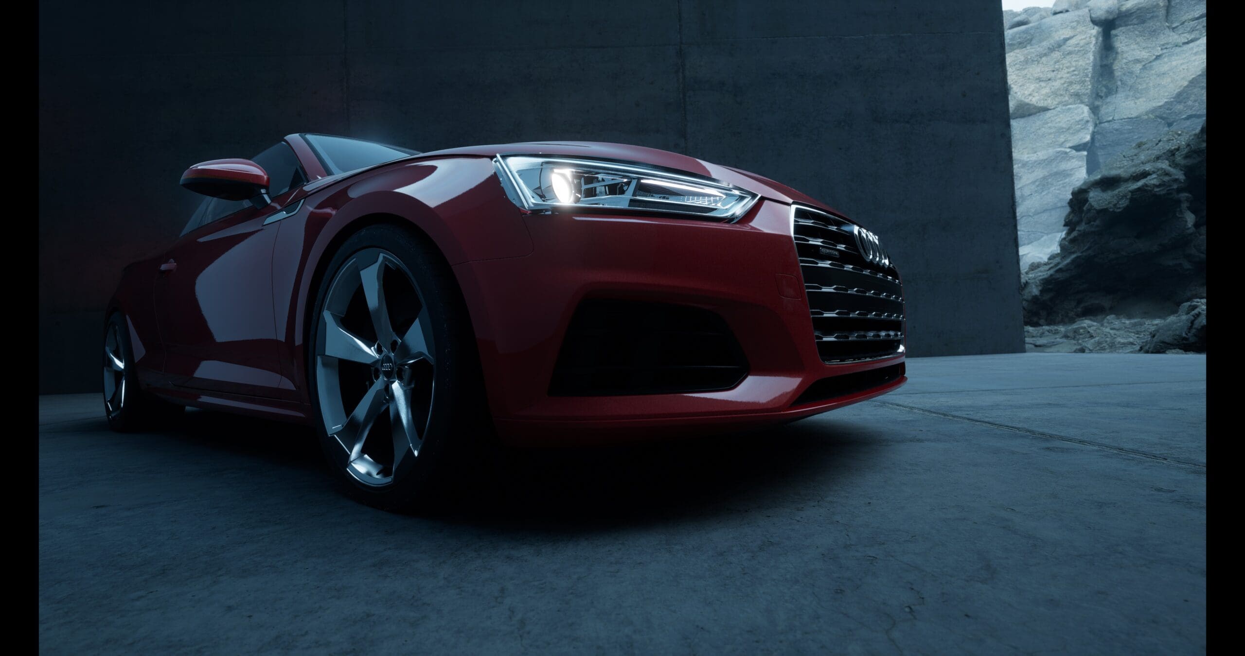 red audi car in front of rendered granite background