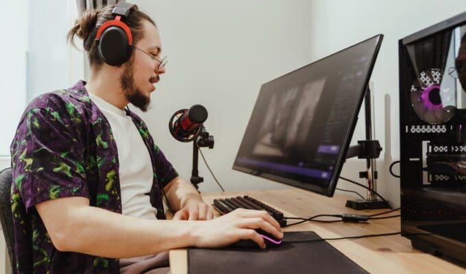 Young stylish man during commenting esports match stream stock photo